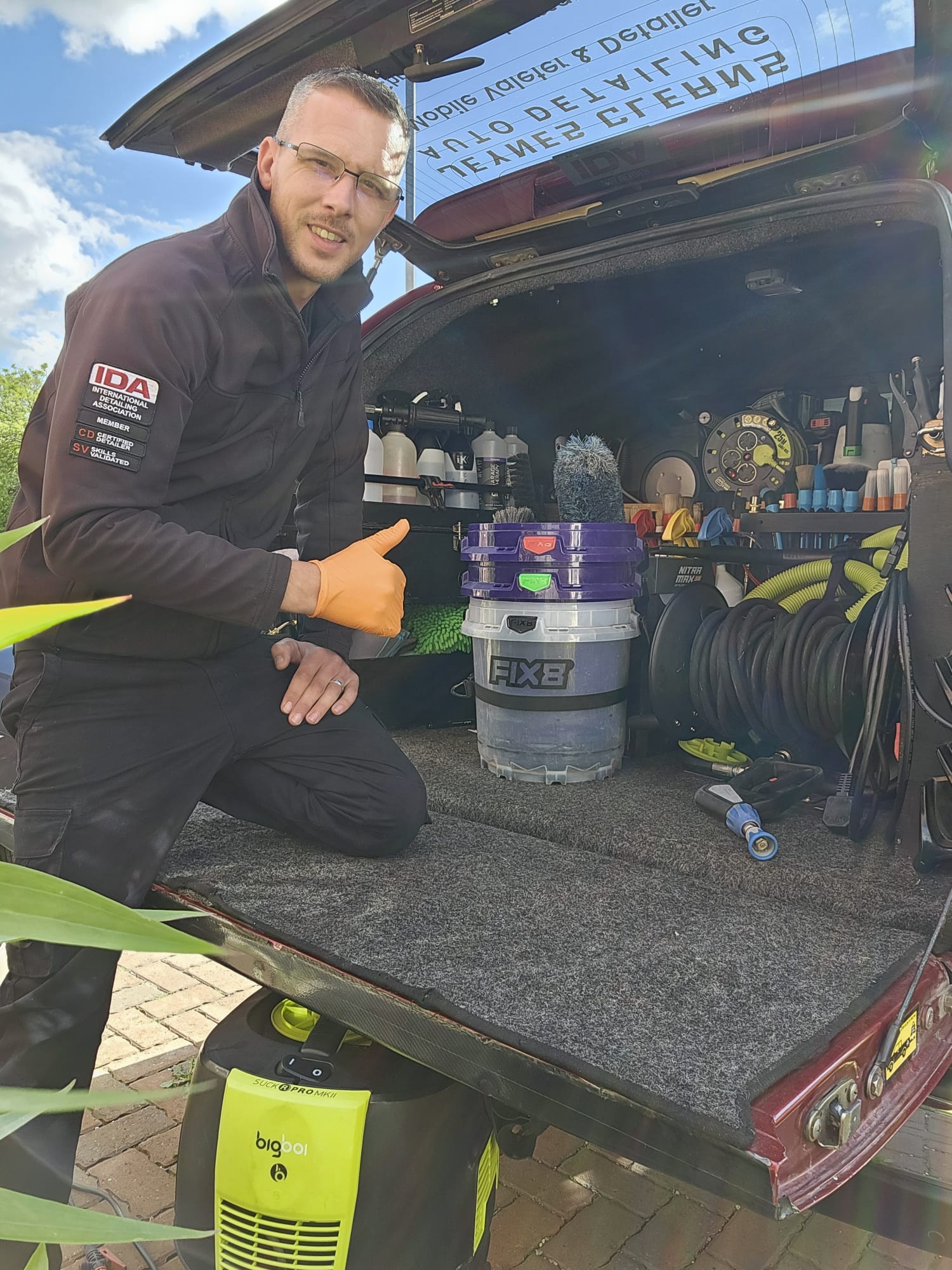 Chris Jeynes, IDA certified detailer, detailing a customer's car