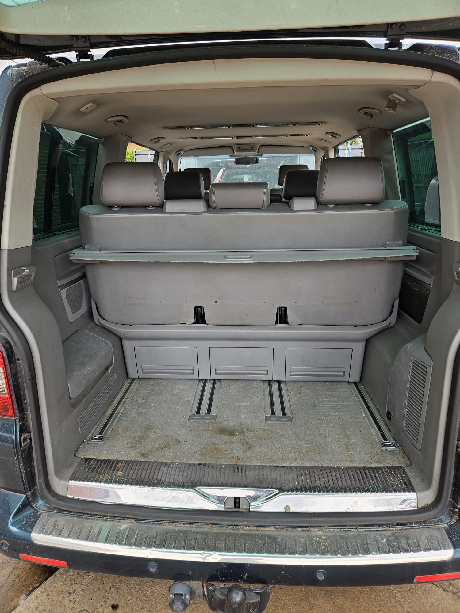 Vehicle load space before carpet and trim cleaning