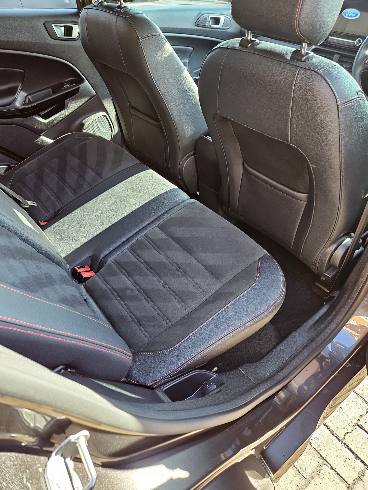 Clean rear seats and carpets in a Ford interior
