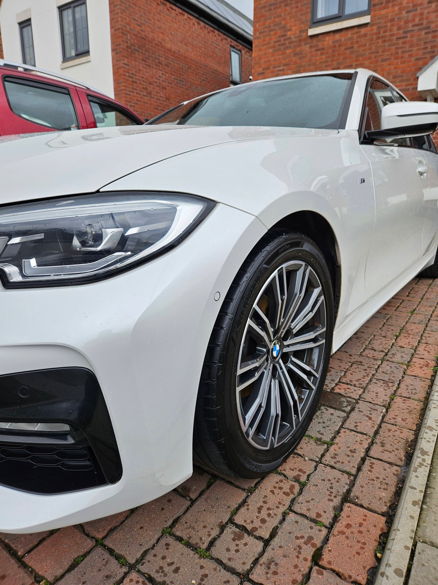 White BMW 3 Series M Sport front wing and wheel after cleaning